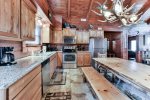 Prepare a Home Cooked Meal in This Kitchen with Top-of-the-Line Stainless Steel Appliances